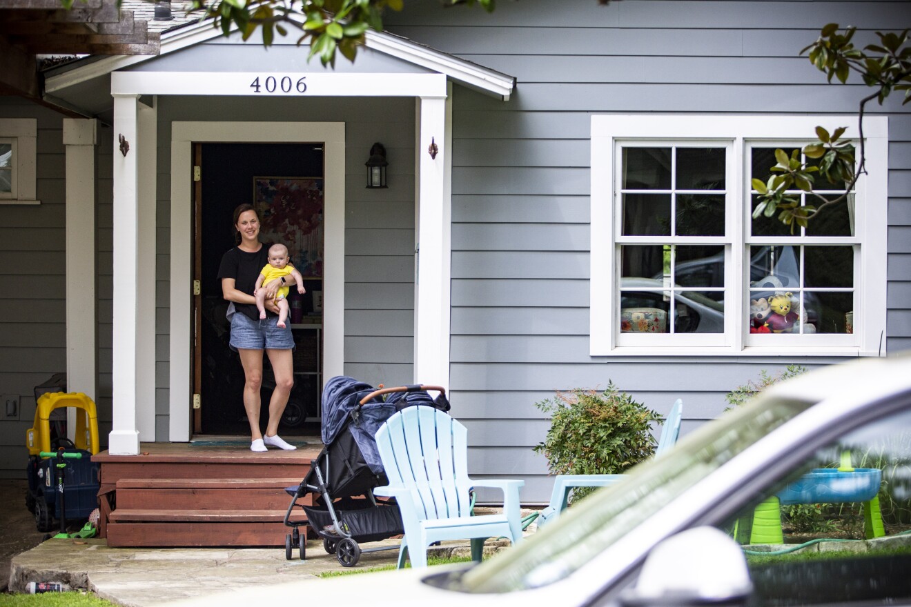 Ashley Whitt and her son Charlie have several stuffed animals in their window.